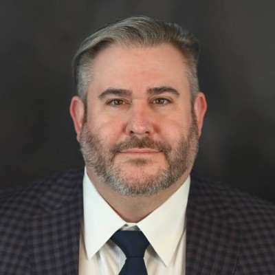 Mark_French seen in black color suit